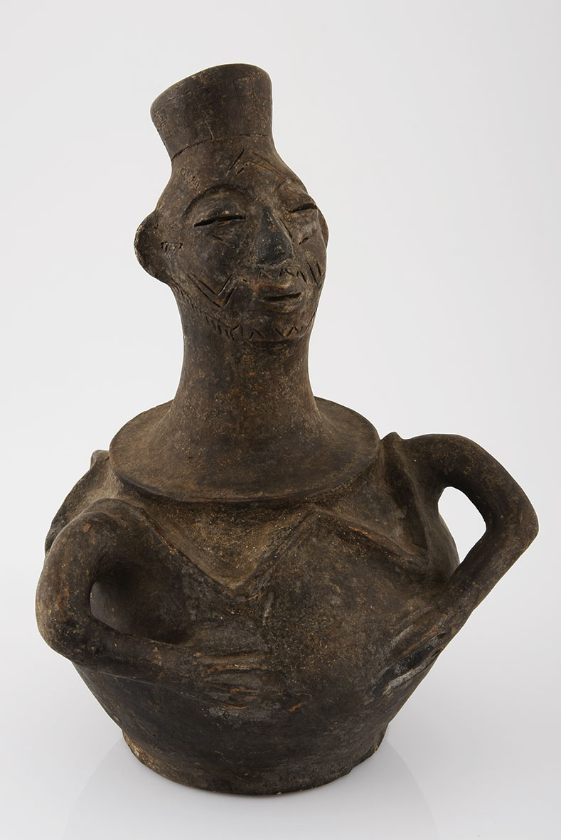 A CHOKWE CLAY VESSEL, ANGOLA the spout modelled in the form of a head, the ovoid body with molded