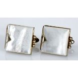 A PAIR OF MOTHER-OF-PEARL CUFFLINKS, SWANK each of square form, in a metal frame, impressed SWANK,