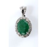 AN EMERALD AND DIAMOND PENDANT centred with an oval mixed-cut emerald weighing 1.44cts, within a