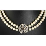 A DOUBLE-STRAND PEARL CHOKER composed of two strands of forty-four and forty-eight pearls,