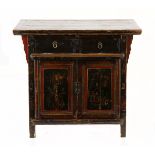 A CHINESE LACQUERED CHEST the hinged rectangular top enclosing a compartment, carved and panelled