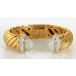 AN 18CT GOLD AND DIAMOND BANGLE, DAVID YURMAN designed as a narrow cuff of cable form, each end