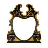 A VICTORIAN EBONISED AND GOLD PAINTED OVERMANTEL MIRROR the circular plate within a carved frame