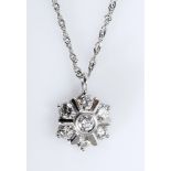 A DIAMOND PENDANT of flower head form, centred with a bezel-set brilliant-cut diamond weighing