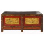 A CHINESE RED-LACQUER ELM AND PAINTED LOW CHEST the rectangular top with two hinged lids, each