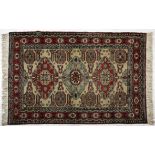 AN ARDEBIL RUG, PERSIA, MODERN the ivory field with three stylised  diamond medallions depicted in