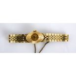 A LADY'S 18CT GOLD WRISTWATCH, ROLEX PRECISION manual, the circular gilt dial applied with baton