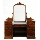 A VICTORIAN WALNUT AND ROSEWOOD MIRROR-BACKED DRESSING TABLE the shaped plate within a conforming