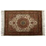 A TABRIZ RUG, NORTH WEST PERSIA, MODERN the ivory field with a rose star medallion, similar