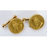 A PAIR OF COIN-MOUNTED CUFFLINKS set with a 1897 and 1898 one pond coin, with bar and chain