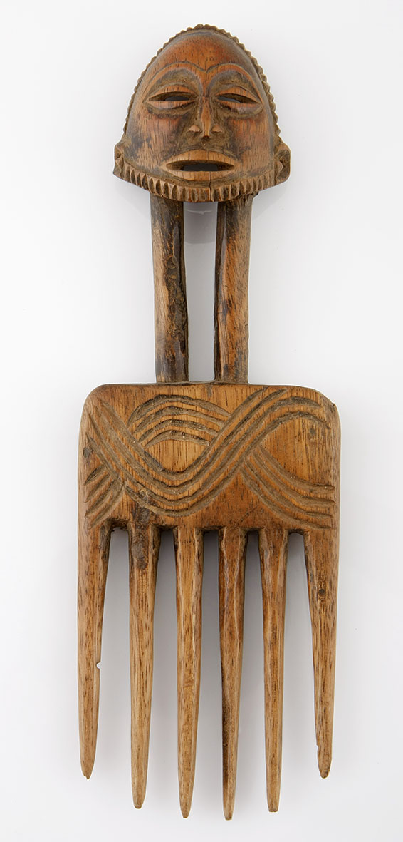 A HEMBA COMB, DEMOCRATIC REPUBLIC OF CONGO the handle carved in the form of a bearded male mask 23,