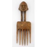 A HEMBA COMB, DEMOCRATIC REPUBLIC OF CONGO the handle carved in the form of a bearded male mask 23,