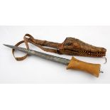 A NUBIAN DAGGER, NORTHERN SAHARA NOT SUITABLE FOR EXPORT the forged steel blade with wooden hilt,