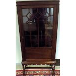 A FRUITWOOD DISPLAY CABINET the moulded rectangular pediment above a plain frieze, a glazed door