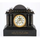 AN AMERICAN BLACK SLATE TABLE CLOCK the 15cm dial with a white enamelled chapter ring with Roman