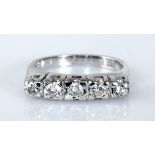 A DIAMOND RING centred with a line of brilliant-cut diamonds weighing approximately 0.48cts in