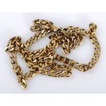 A 9CT GOLD CHAIN composed of flat curb links, approximately 510mm in length