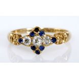 A SAPPHIRE AND DIAMOND RING centred with three old-cut diamonds weighing approximately 0.17cts in