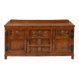 AN OAK LOWBOY, 18TH CENTURY the rectangular top above three central graduating short drawers flanked
