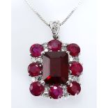 A RUBY AND DIAMOND PENDANT centred with an emerald-cut ruby weighing approximately 5.36cts, within a