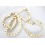 AN IVORY NECKLACE NOT SUITABLE FOR EXPORT composed of graduated ivory beads, approximately 650mm