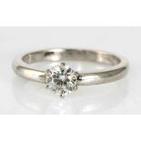 A SOLITAIRE DIAMOND RING claw-set with a brilliant-cut diamond weighing approximately 0.60cts, in