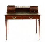 AN EDWARDIAN MAHOGANY AND INLAID WRITING TABLE the rectangular top with gilt-tooled leather inset