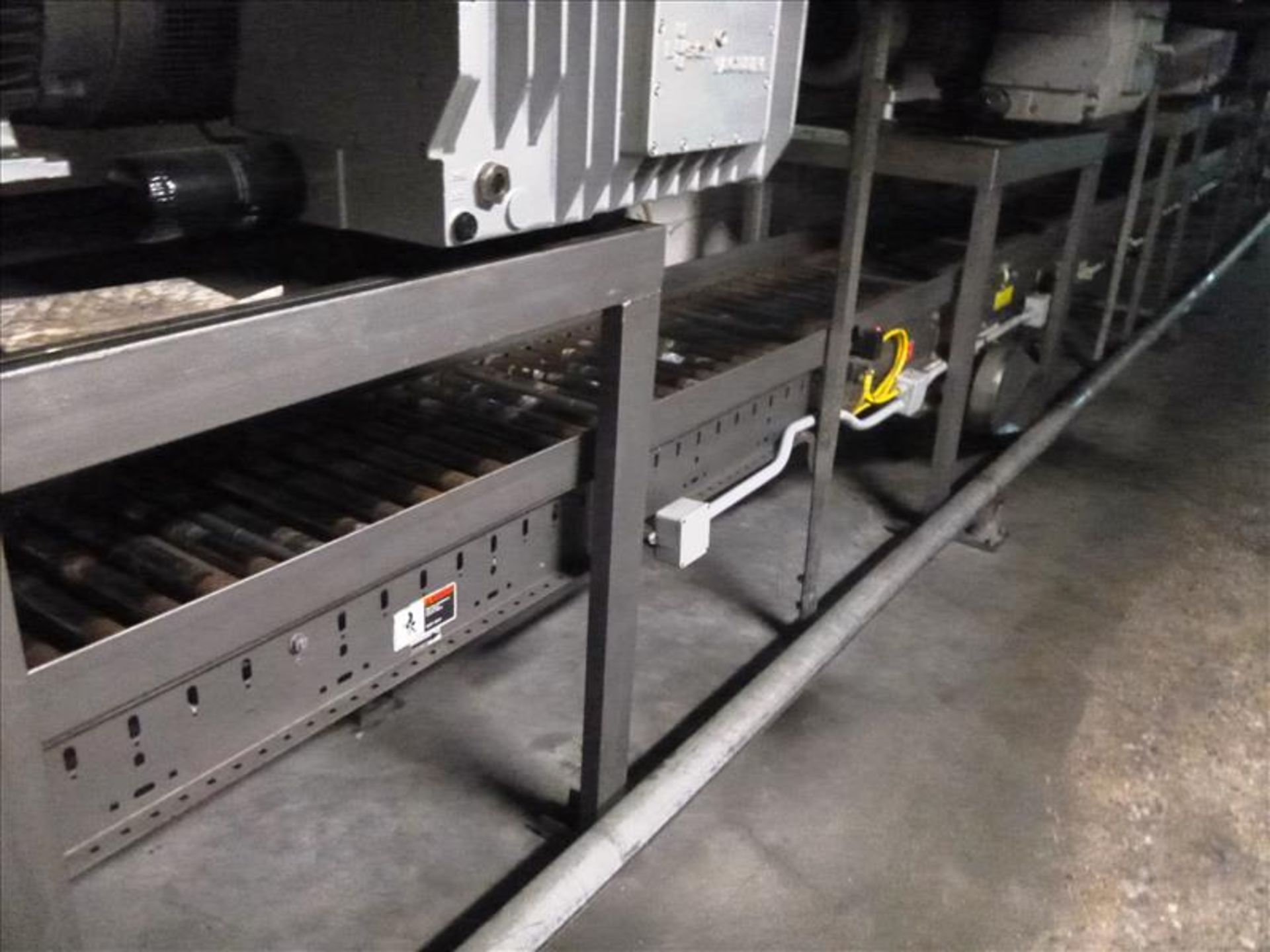 100 ft. powered roller conveyor 21 in. W. (located at 321 Courtland Ave E Kitchener ON Canada)
