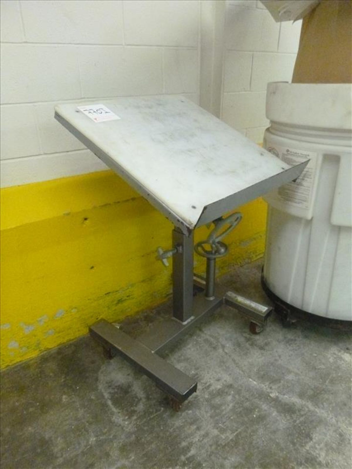 adjustable table on casters (located at 150 Bartor Rd Toronto ON Canada)