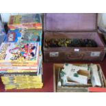 A vintage suitcase of toy soldiers and a fort plus vintage children annuals