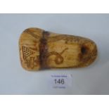 Carved bone scrimshaw of sailing boats and a sea serpent