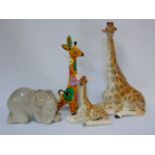 4 USSR figures of animals to include 2 Lomonosov examples 3 giraffes and an elephant