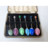 5 Matching Enamel backed spoons, plus one smaller example