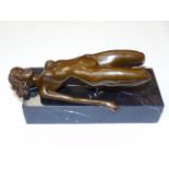 Bronze of a female figure in a reclining squat position.  Approx 4 1/4" high including the base