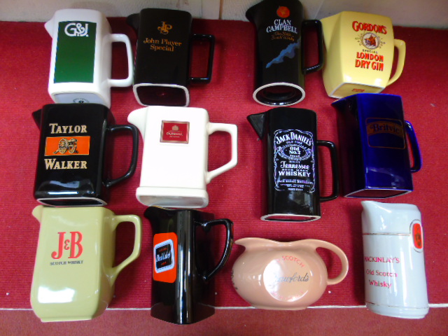 Assorted pub advertising water jugs.  12 pieces.