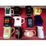 Assorted pub advertising water jugs.  12 pieces.