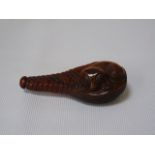A carved snuff bottle with animal decoration approx 2 1/2" long
