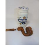 Afircan carved wooden pipe and a Delft tobacco jar