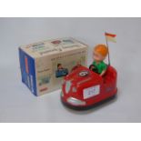 A Boxed battery operated dodge-em toy by Laurie