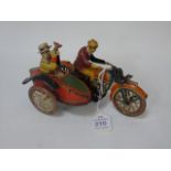 A vintage Clockwork Motorcycle and sidecar with riders