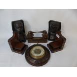 2 Pairs of carved wooden bookends, circular barometer and wooden container