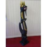 A large carved and painted wooden dragon approx 4ft 10" in height