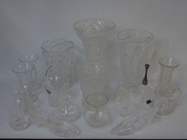 A collection of crystal glass vases and ornaments.