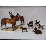 A collection of 7 figures of chestnut brown horses, to include some Beswick examples