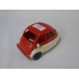 A Vintage plastic model of an Isetta toy car