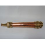 An antique copper and brass firemans hose attachment stamped Merryweather London