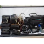 A Collection of vintage cameras and a vintage videostar camcorder