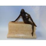 Bronze of a lady seated on a onyx base approx. 8" high inc base.