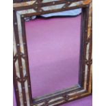 A rectangular wall mirror with bone inlaid decoration