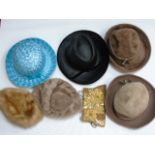 A box of vintage ladies hats and purses